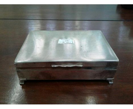 of rectangular form with an engine turned top, raised on bracket feet 