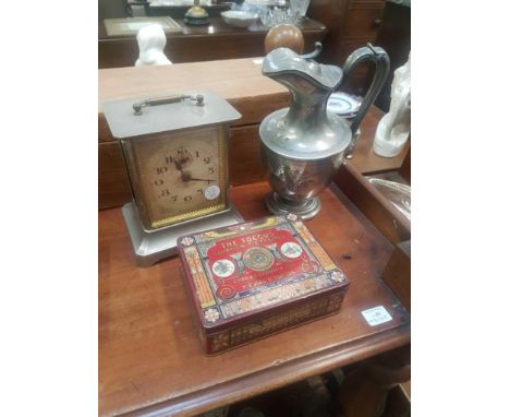 including plated claret jug, ciggarette tins and a carriage clock 