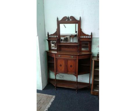 the carved mirror back with open display shelves raised above a plain moulded top with central frieze drawer above a two door