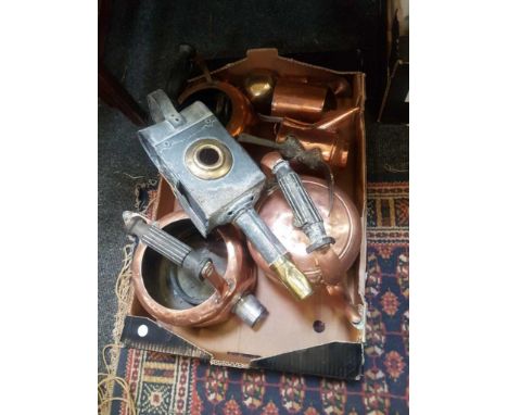 together with other copperware and a carriage lamp 