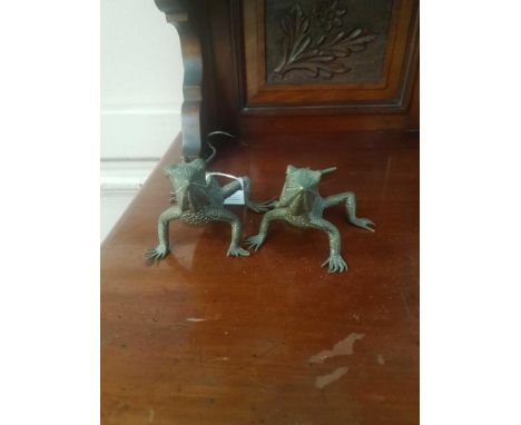 the realistic water dragons with incised scales and raised spiked backs, depicted standing with raised heads 