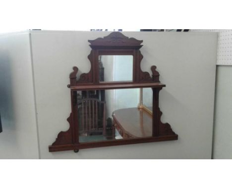 in a small size, the carved cornice resting on top of a small mirror above an open display shelf supported by a larger mirror