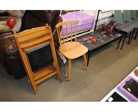 A five branch ceiling light, retro tile top coffee table, stick back chair, magazine rack and three folding chairs