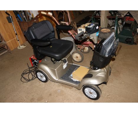 A CareCo mobility scooter with accessories and charger