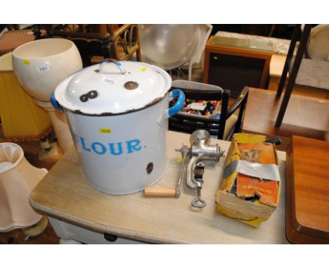 An enamel bread bin and two Spong mincers