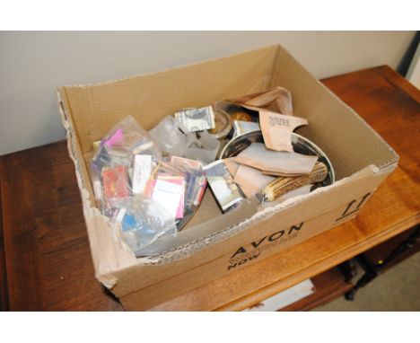 A box containing match books; scale weights; coinage; bank notes etc.
