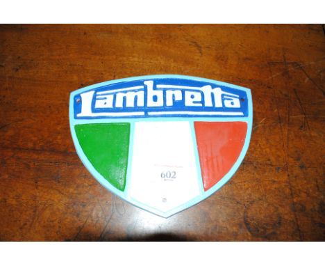 A reproduction cast iron Lambretta shield shaped plaque