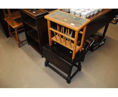 A modern tile topped magazine rack and an oak drop leaf coffee table