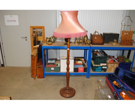 A standard lamp with tasselled shade (needs rewiring) 