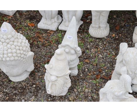 Two concrete garden ornaments in the form of gnomes