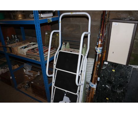 A wooden step ladder and metal framed step ladder 