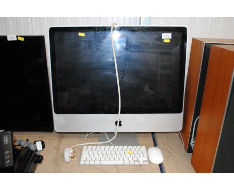 An Apple iMac computer with keyboard and mouse