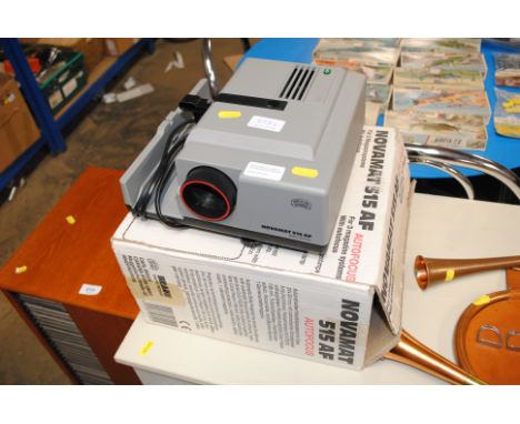 A Novamat slide projector and original box