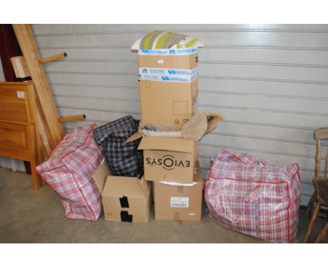 A large quantity of various clothes and textiles