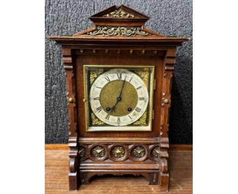 A 19th German carved oak and parcel gilt architectural cased bracket clock 