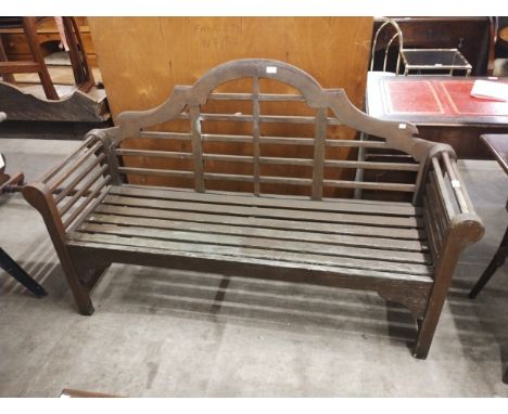 A Lutyens style teak garden bench 