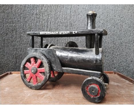 A hand made wooden traction engine model 
