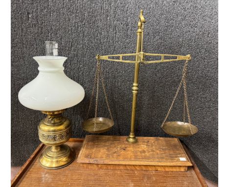 A brass oil lamp and a set of brass scales 