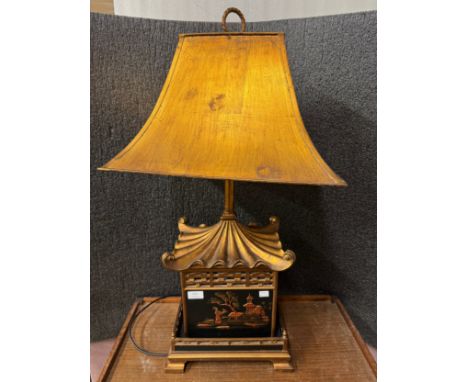 A black lacquered chinoiserie and gilt pagoda shaped table lamp 
