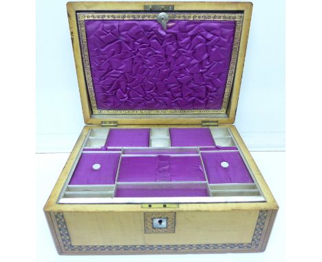 A marquetry and mother of pearl inlaid sewing box