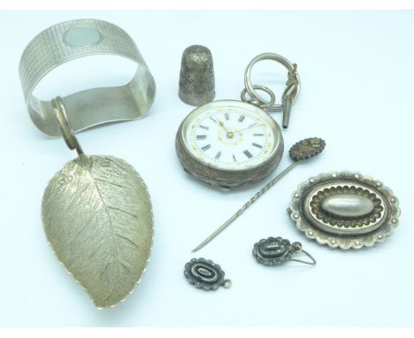 A silver napkin ring, a silver thimble, a/f, a silver fob watch, marked .935, a silver leaf shaped caddy spoon, etc., brooch 