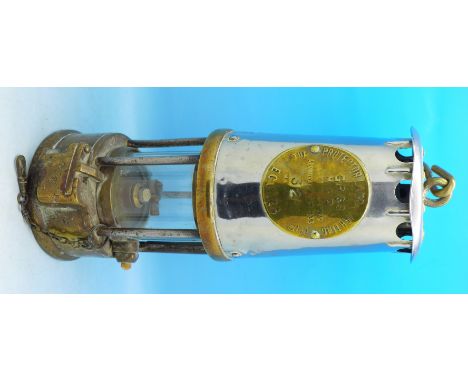An Eccles miner's safety lamp marked Protector Lamp & Lighting Co. Ltd.