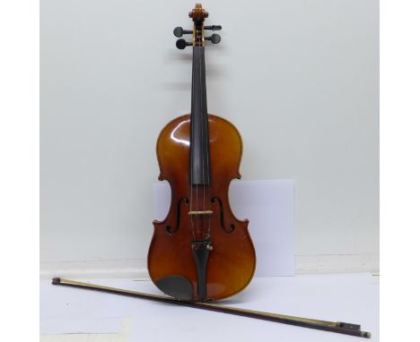 An early 20th Century Rushworth & Dreaper violin and bow, cased, length of back without button 36cm