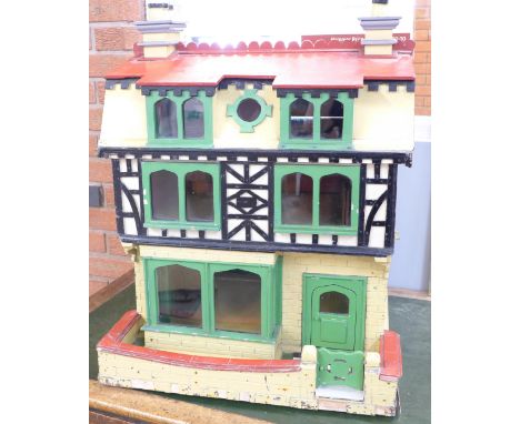 A mock Tudor dolls house with lighting