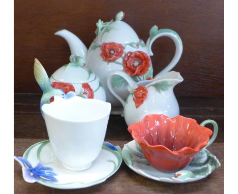 A Franz china three piece tea service and two cups and saucers