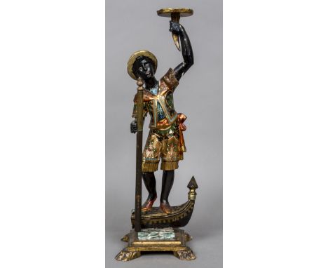 A late 19th/early 20th century Venetian painted carved wooden BlackamoorModelled as a gondolier standing on the prow of the g