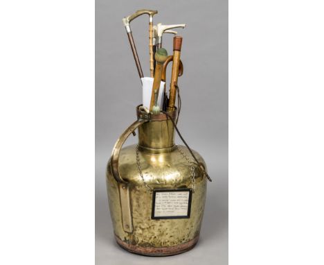 A large 19th century copper and brass water jugFitted with a framed hand written label inscribed This brass flagon came out o