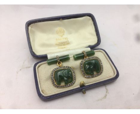 A pair of Russian gold diamond set jade mounted cufflinks, with 56 Zolotnik mark, maker's mark AH and stamped Faberge in cyri