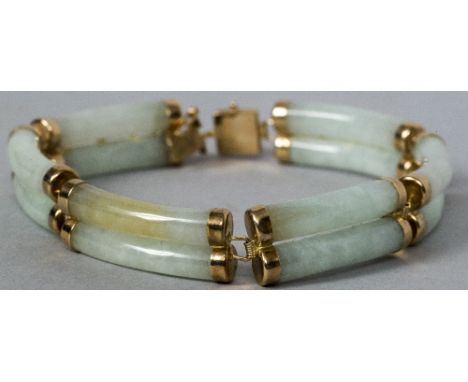 A Chinese 14 ct gold mounted carved jade sectional bracelet The clasp stamped 585 and 14K.  18 cm long.    CONDITION REPORTS: