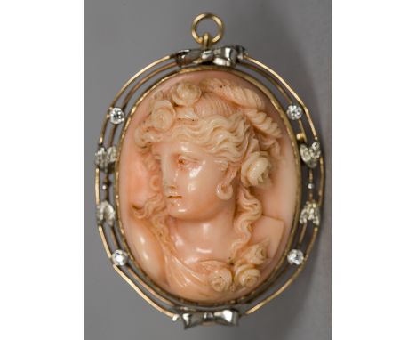 An unmarked yellow metal diamond set carved coral broochWorked with the portrait bust of a young lady, with hinged suspension