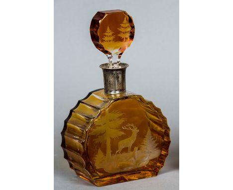 A Bohemian 800 standard silver mounted amber glass decanter and stopperThe body engraved with a stag in a wooded landscape.  