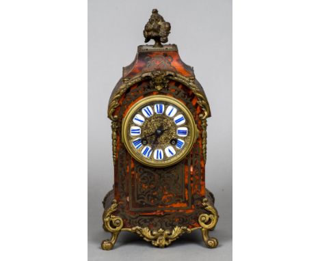 A boulle cased mantel clockThe enamelled sectional dial with Roman numerals, the signed Japy Freres barrel movement striking 