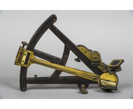 A 19th century brass mounted ebony octant
Of typical form; together with a hand written and illustrated volume Guide to the S