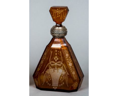 A Bohemian 800 standard silver mounted amber glass decanter and stopperThe body engraved with a basket issuing flowers.  24. 