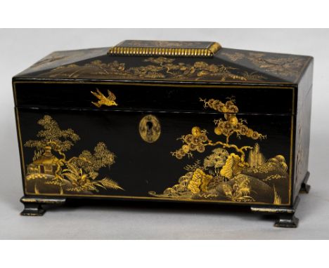 A 19th century chinoiserie lacquered tea caddyThe hinged cover enclosing three lidded compartments, standing on ogee bracket 