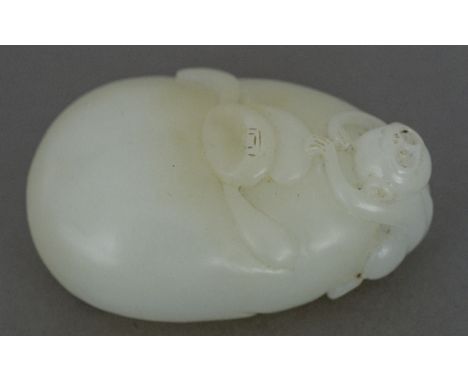 A Chinese carved white jade pebbleSurmounted with the figure of a monkey.  5.5 cm wide.    CONDITION REPORTS:  Generally in g