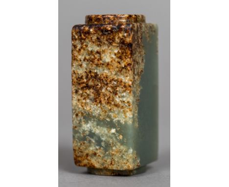 A Chinese carved green and russet jade kongOf typical form.  5.5 cm high.    CONDITION REPORTS:  Generally in good condition,