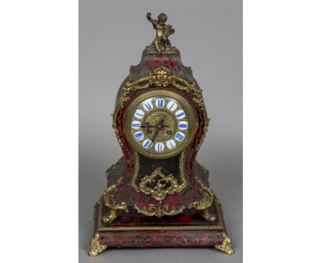 A 19th century boulle mantel clockThe top surmounted with a gilt metal putto, the dial with enamelled Roman numerals and twin