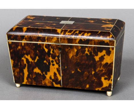 A 19th century tortoiseshell tea caddy
The domed hinged rectangular top including two lidded compartments, above the main bod