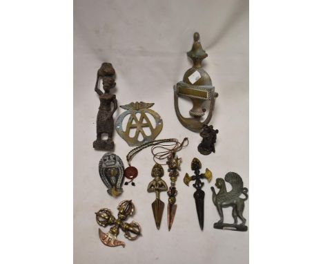 A selection of metal wares including door knocker, an early AA badge and ethnic figures.
Door knocker in good condition but n