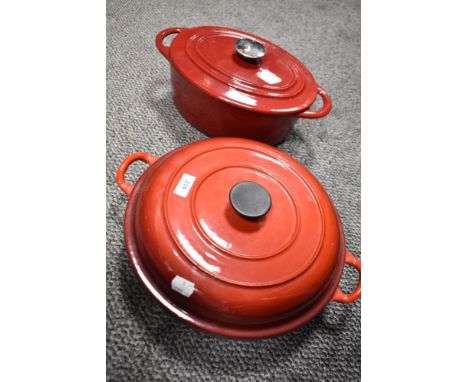 Two modern red enamel lidded Caserole dishes. In the style of Le Creuset.