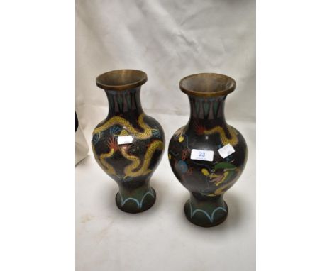 A pair of early 20th century Chinese cloisonne vase of baluster form decorated with traditional yellow imperial dragons. 29cm