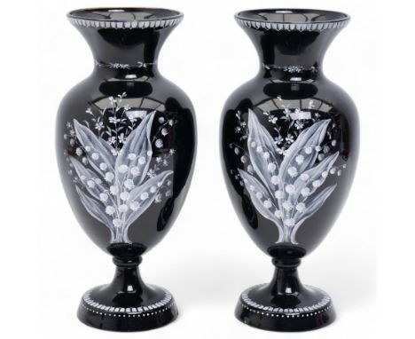 Pair of Victorian black glass vases, of baluster form, decorated with blossoming floral decoration in white enamel, H30cm 