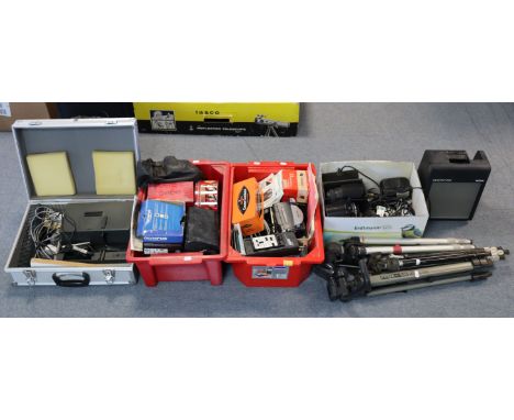 Thee camera lenses; various camera accessories; a Leitz “Pradovit RA150” slide projector, etc.