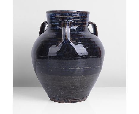 Stoneware, layered blue over iron glazes with white splashes at the neck and running over the shoulder, mounted with three lo