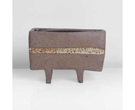 Stoneware, dry brown body with dark speckle, a white splash with iron speckle around the body, the interior with dark brown g